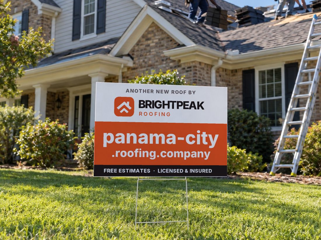 panama-city.roofing.company on a yard sign in front of a house getting a new roof